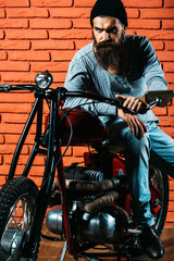 Fototapeta na wymiar bearded biker man on motorbike
