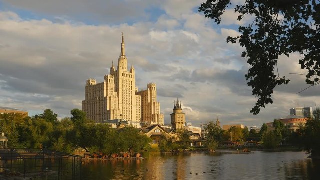 Kudrinskaya Square Building is one of seven Stalinist skyscrapers. Against the backdrop of the lake. Evening.