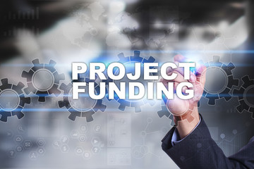 Businessman is drawing on virtual screen. project funding concept.