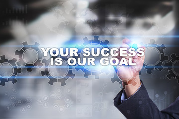 Businessman is drawing on virtual screen. your success is our goal concept.