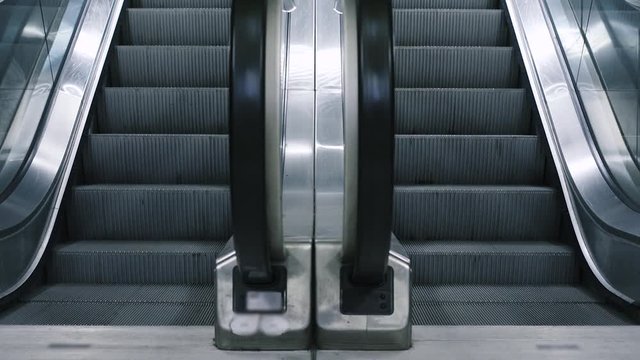 Close-up Shot Of Empty Moving Staircase Running Up And Down. Modern Escalator Stairs, Which Moves Indoor.