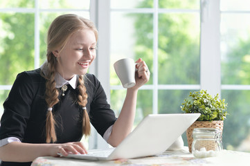 happy girl using laptop