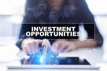 Woman is using tablet pc, pressing on virtual screen and selecting investment opportunities