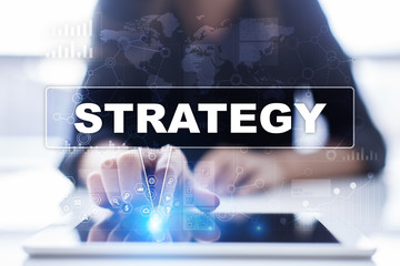 Woman is using tablet pc, pressing on virtual screen and selecting strategy