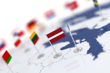 Latvia flag in the focus. Europe map with countries flags