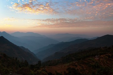 Evening view of blue horizons in Himalayas and red clouds