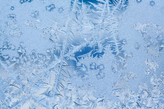 Frozen ice window texture, snowflakes and icy background, close-up, soft focus photo