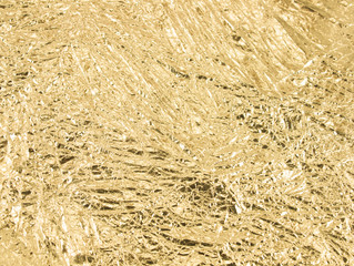 Gold wrinkled paper texture abstract background