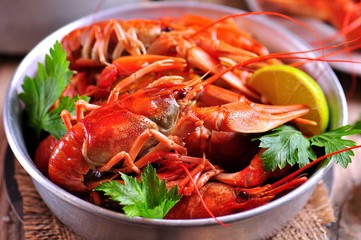 Red boiled crayfish on wooden background