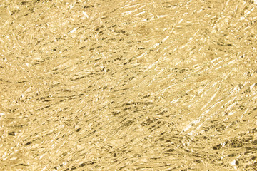 Gold wrinkled paper texture abstract background