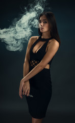 Beautiful girl with the e-cigarette