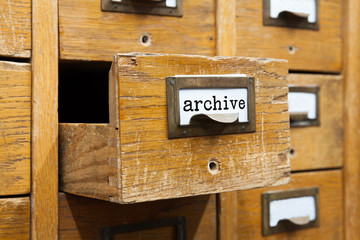 Archive system concept photo. Opened box archive storage, filing cabinet interior. wooden boxes with index cards. library service information management. - obrazy, fototapety, plakaty