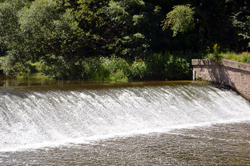 small river sluice in summer detail front photography