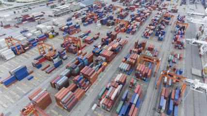 Cargo containers at seaport in aerial view