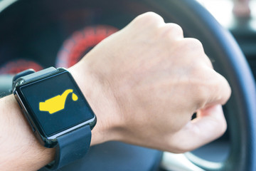Close-up smart watch notification fuel icon