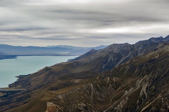 The Tasman River in Aoraki / Mount Cook National Park, flowing through the wide flat-bottomed Tasman Valley in the Southern Alps and into the northern end of the glacial lake Pukaki