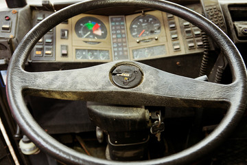 steering wheel and cockpit of an old bus