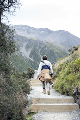 A man taking photo along the walking trail to the Blue Lakes and Tasman Glacier View, Aoraki / Mount Cook National Park