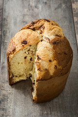 Christmas cake panettone on wooden background

