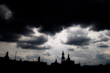 Fototapeta premium Shadow siluette of the city skyline dresden with dark storm clouds 