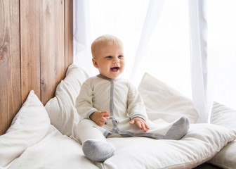 Fototapeta premium Little baby smiling and looking away
