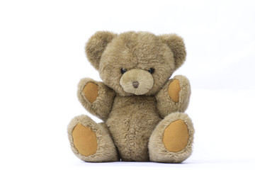 Brown teddy bear on white background.