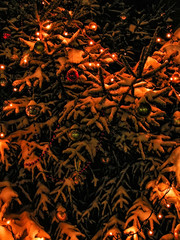 Warm image of brightly decorated christmas and new year tree with garland