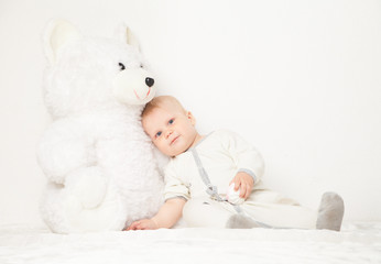 Baby with big teddy bear