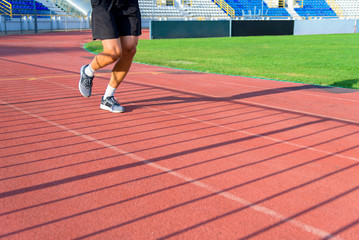 The sportsman the athlete trains at stadium.