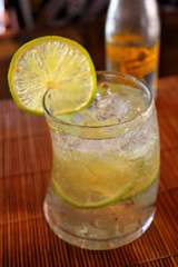 Glass of iced gin tonic soda with lemon slices