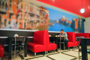 The young man in the cafe alone