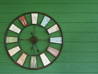 Old vintage clock on wooden wall