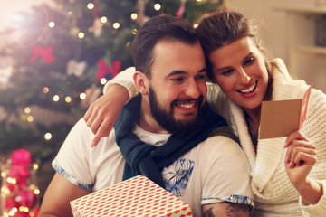 Happy couple with Christmas presents