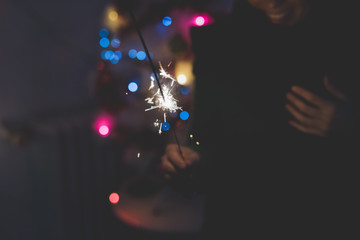 Close up on a sparkler firework for new year's eve celebrations - celebrate, holiday concept
