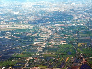 aerial view of clouds and village landscape