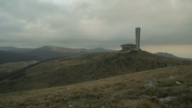 Storm clouds over the derelict concrete ruin of the Buzludzha communist monument on Mount Hadji Dimitar, Stara Planina, Bulgaria