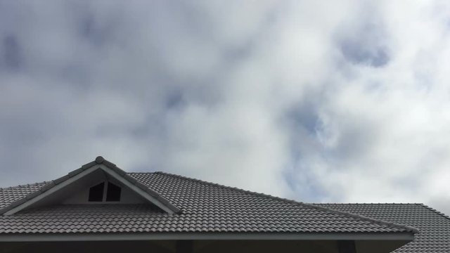 Time lapse moving cloud over the horizontal roof