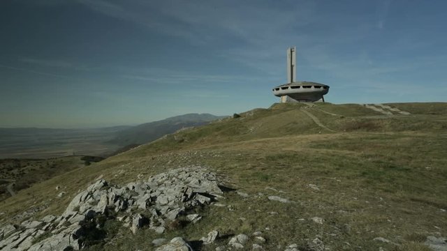 The empty ruined shell of the Memorial House of the Bulgarian Communist Party on Mount Buzludzha, Bulgaria. Camera pan and static hold.