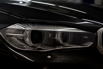 Modern car headlights. Exterior detail.
