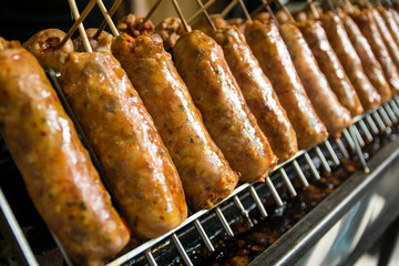 Big thai spice sausage on grill,It smells fragrant and full of thai spice.At 