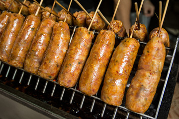 Big thai spice sausage on grill,It smells fragrant and full of thai spice.At 