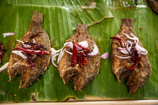 Fish fry with thai spice."Salid" fish (Trichogaster pectoralis fish) on banana leafl,Thailand