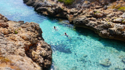 Couple swimming in inlet - miniature