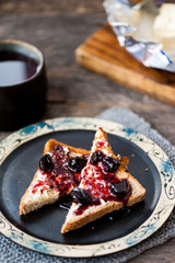 Toast with butter and sour cherry jam