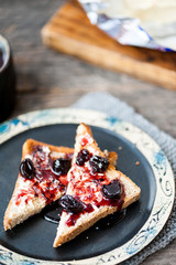 Toast with butter and sour cherry jam