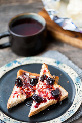Toast with butter and sour cherry jam