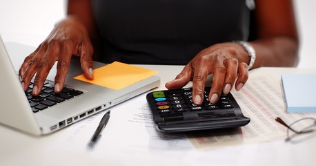 Hands with calculator.