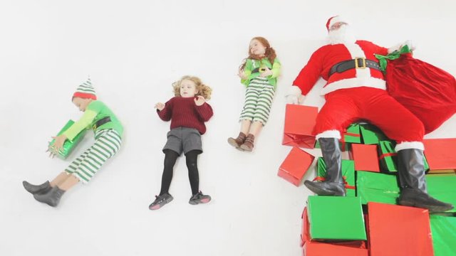 Santa's helpers working at North Pole. Children helps to Santa