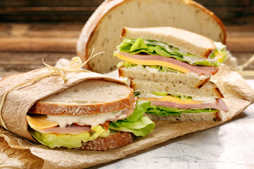 Fototapeta Fresh sandwich with ham cheese and lettuce obraz