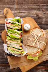 Fresh sandwich with ham cheese and lettuce in bakery mold
